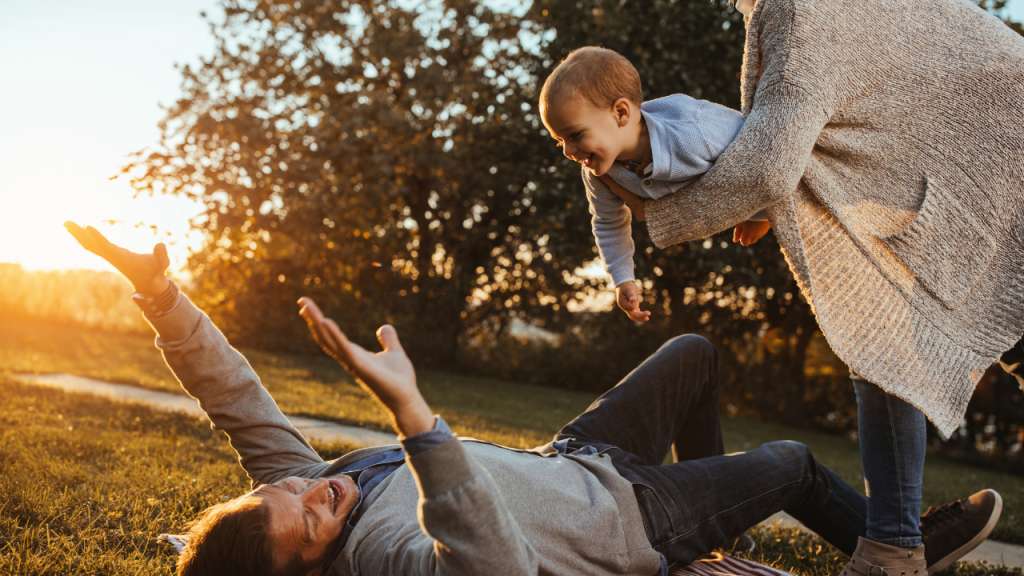Happy parents embracing parenthood later in life, reflecting modern family trends